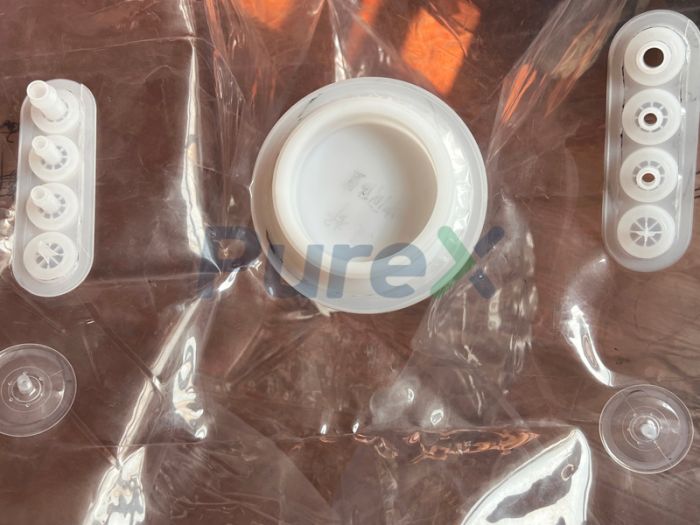 How are the components and connecting tubes thermally welded on the aseptic isolation bag?